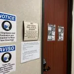Entrance to High Desert Oral & Facial Surgery with signs requiring face coverings