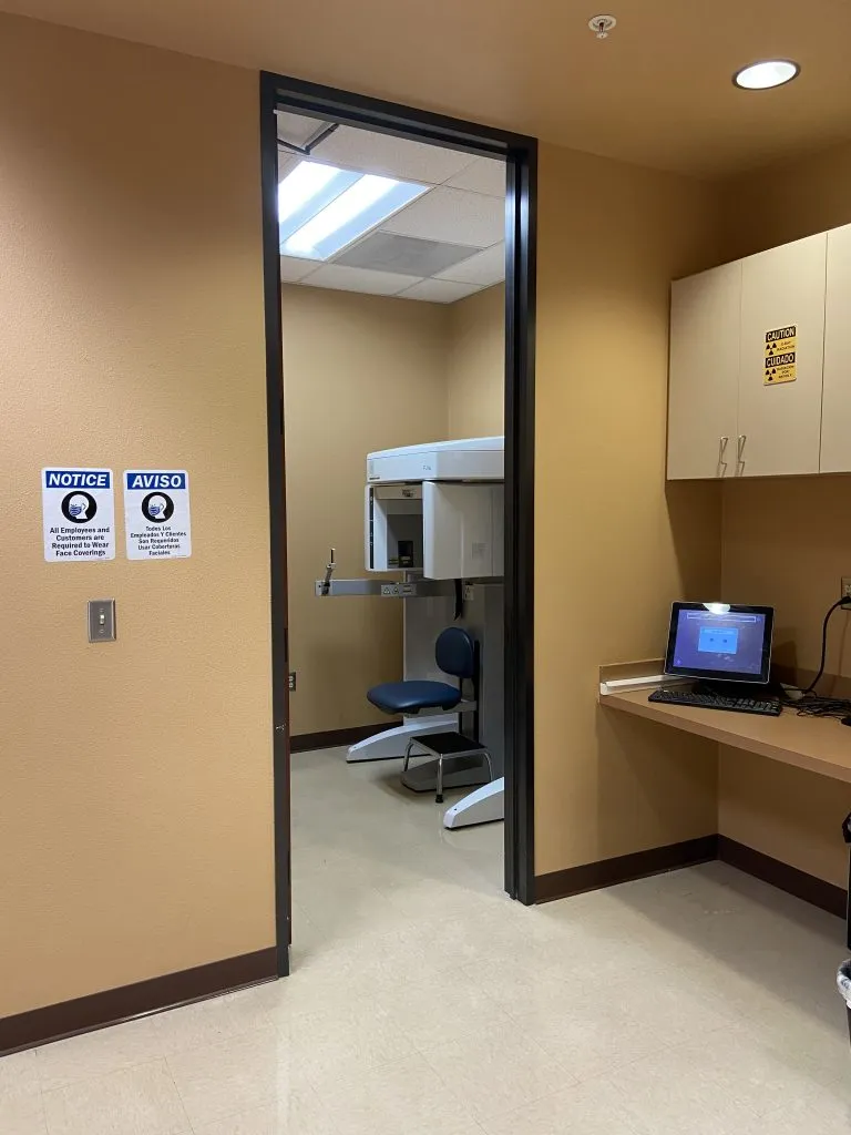 Imaging room at High Desert Oral & Facial Surgery with dental equipment and a computer workstation.